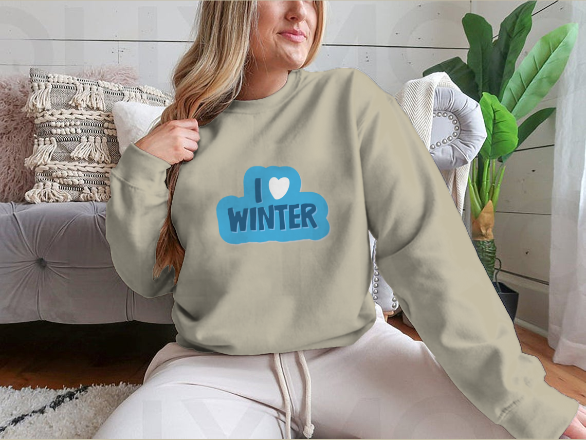 A cozy winter-themed shirt featuring the motivational phrase 'I Love Winter Christmas And New Year' with a heart design, perfect for festive celebrations.