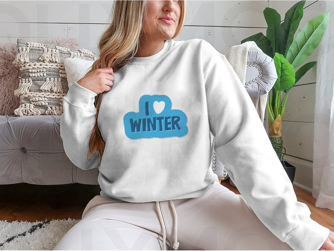 A cozy winter-themed shirt featuring the motivational phrase 'I Love Winter Christmas And New Year' with a heart design, perfect for festive celebrations.