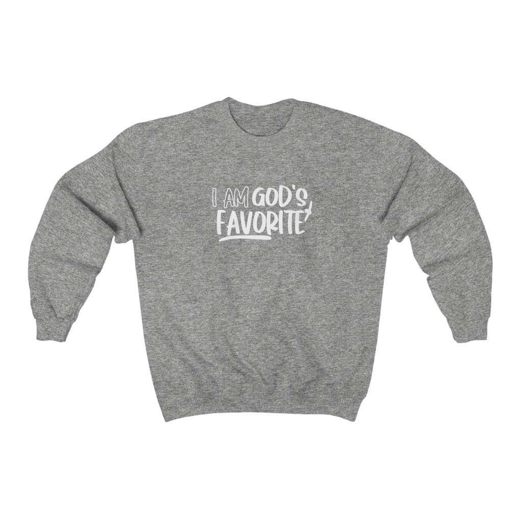 A cozy Gildan sweatshirt featuring the phrase 'I'm God's Favorite' printed on the front, showcasing a loose fit and available in various sizes.