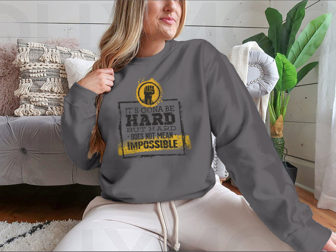 Motivational t-shirt featuring the phrase 'Hard Does Not Mean Impossible' in a stylish design, made from a comfortable cotton/polyester blend.