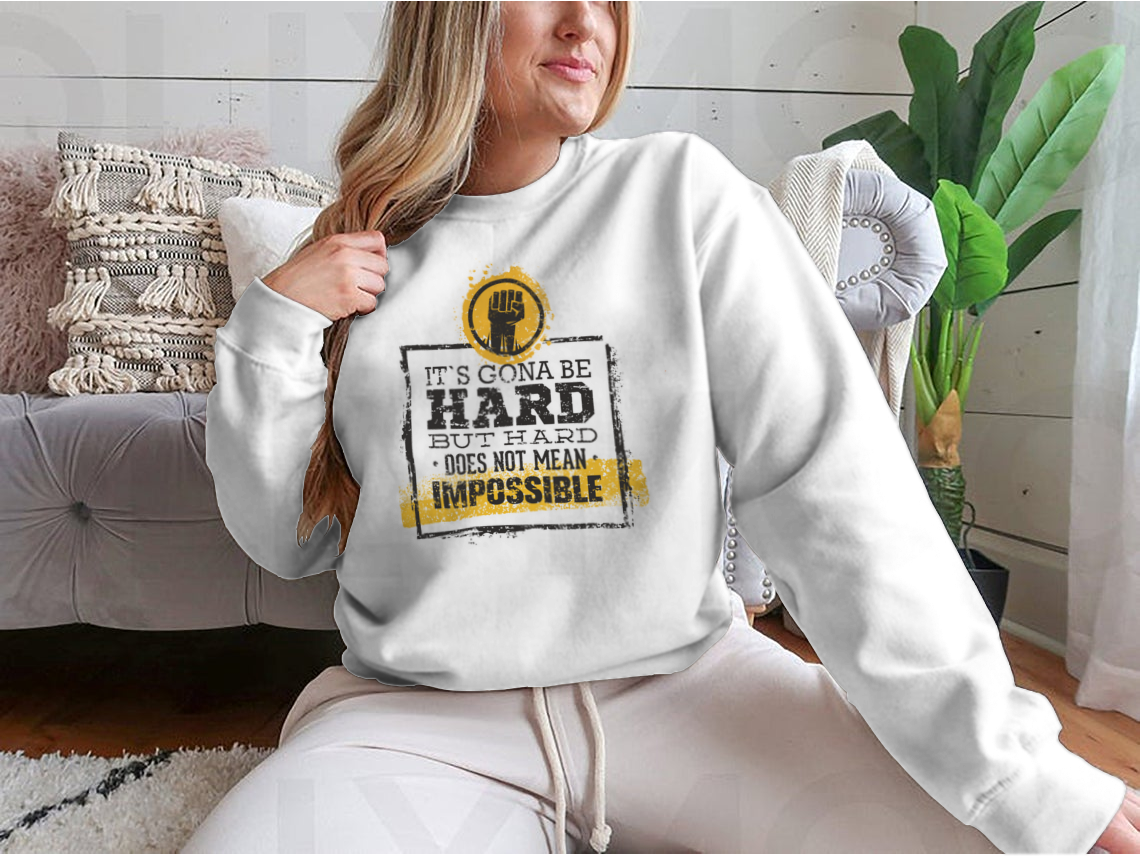 Motivational t-shirt featuring the phrase 'Hard Does Not Mean Impossible' in a stylish design, made from a comfortable cotton/polyester blend.