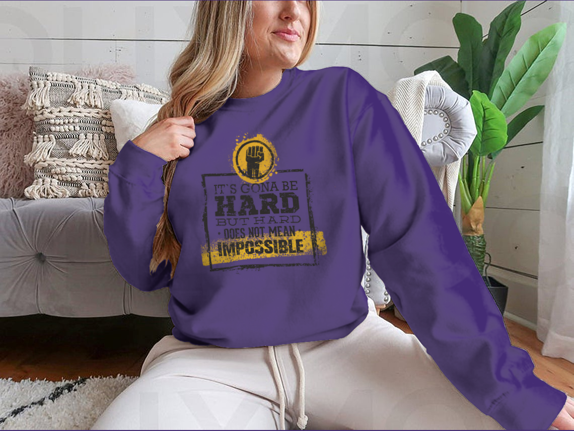 Motivational t-shirt featuring the phrase 'Hard Does Not Mean Impossible' in a stylish design, made from a comfortable cotton/polyester blend.