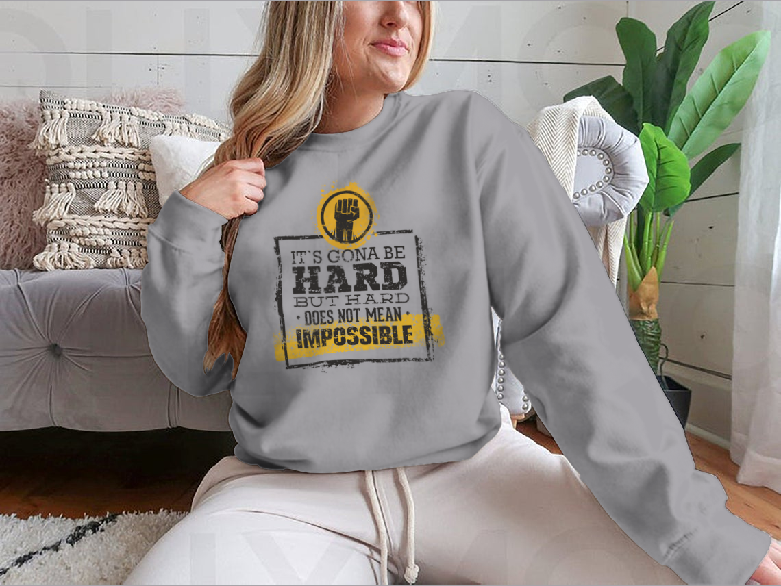 Motivational t-shirt featuring the phrase 'Hard Does Not Mean Impossible' in a stylish design, made from a comfortable cotton/polyester blend.