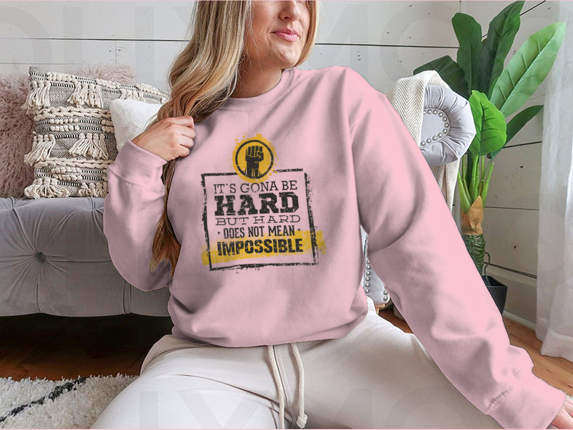 Motivational t-shirt featuring the phrase 'Hard Does Not Mean Impossible' in a stylish design, made from a comfortable cotton/polyester blend.