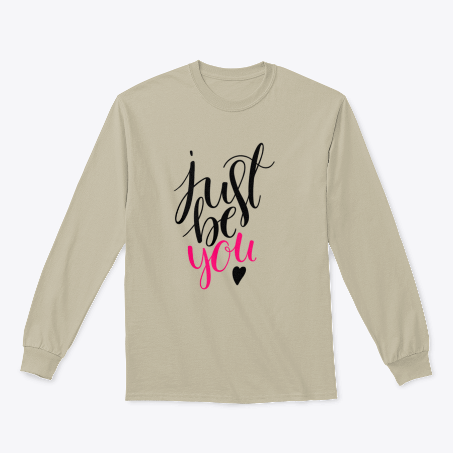 A stylish t-shirt featuring a hand-drawn calligraphy design that reads 'Just Be You', made from high-quality cotton fabric.