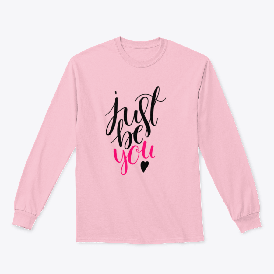 A stylish t-shirt featuring a hand-drawn calligraphy design that reads 'Just Be You', made from high-quality cotton fabric.