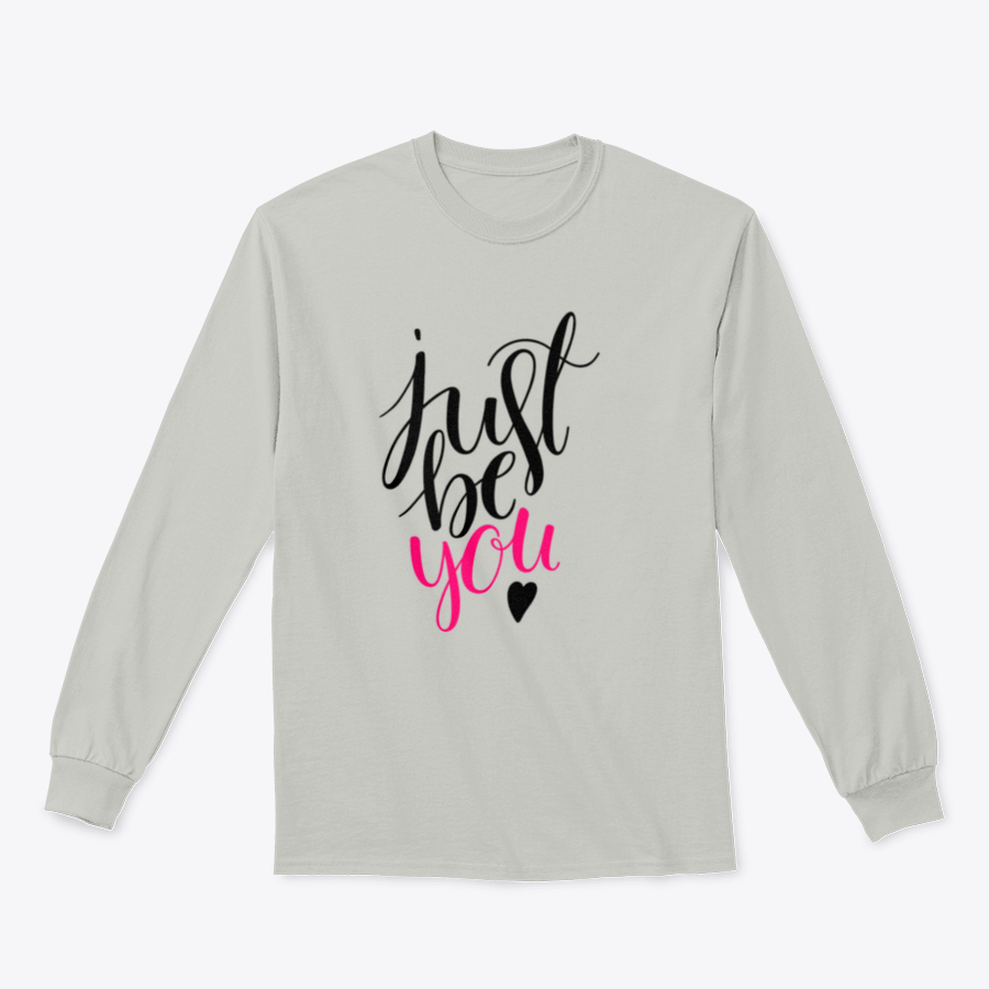 A stylish t-shirt featuring a hand-drawn calligraphy design that reads 'Just Be You', made from high-quality cotton fabric.