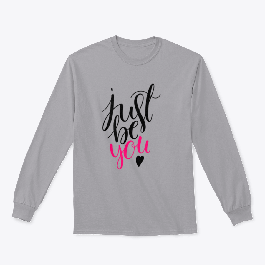 A stylish t-shirt featuring a hand-drawn calligraphy design that reads 'Just Be You', made from high-quality cotton fabric.