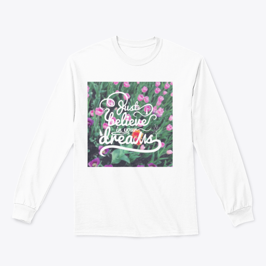 A stylish apparel featuring a blurred background with vibrant tulips and the motivational phrase 'Just Believe In Your Dreams'.