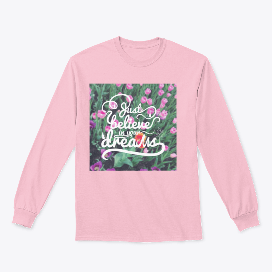 A stylish apparel featuring a blurred background with vibrant tulips and the motivational phrase 'Just Believe In Your Dreams'.