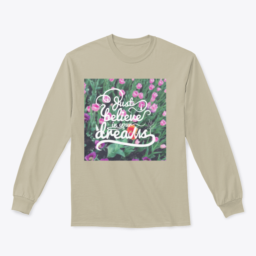 A stylish apparel featuring a blurred background with vibrant tulips and the motivational phrase 'Just Believe In Your Dreams'.