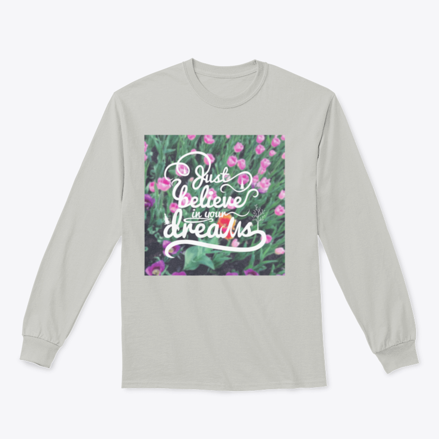 A stylish apparel featuring a blurred background with vibrant tulips and the motivational phrase 'Just Believe In Your Dreams'.