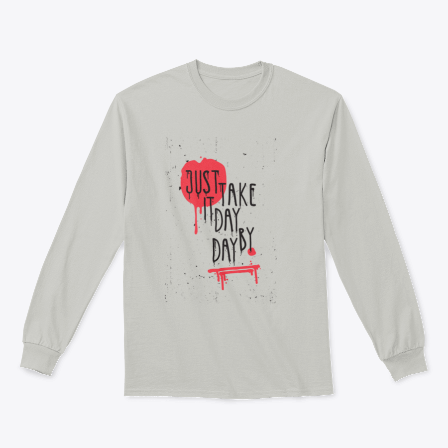 A cozy sweatshirt featuring the motivational phrase 'Just Take It Day By Day' in stylish typography, perfect for casual wear.