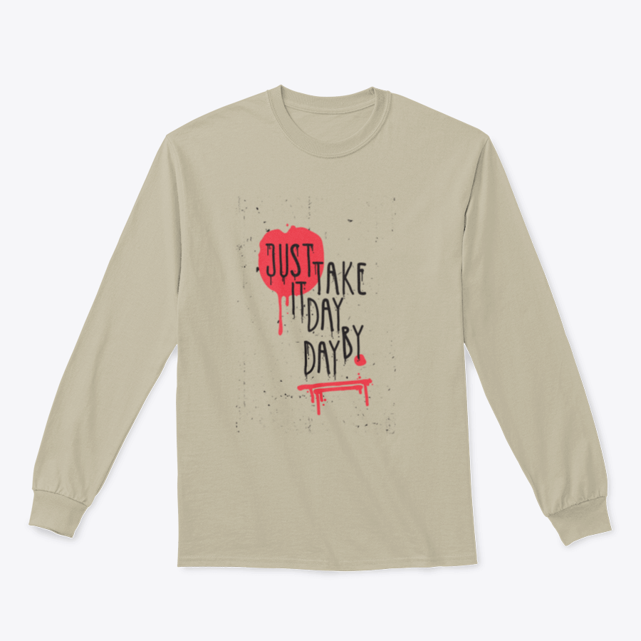 A cozy sweatshirt featuring the motivational phrase 'Just Take It Day By Day' in stylish typography, perfect for casual wear.