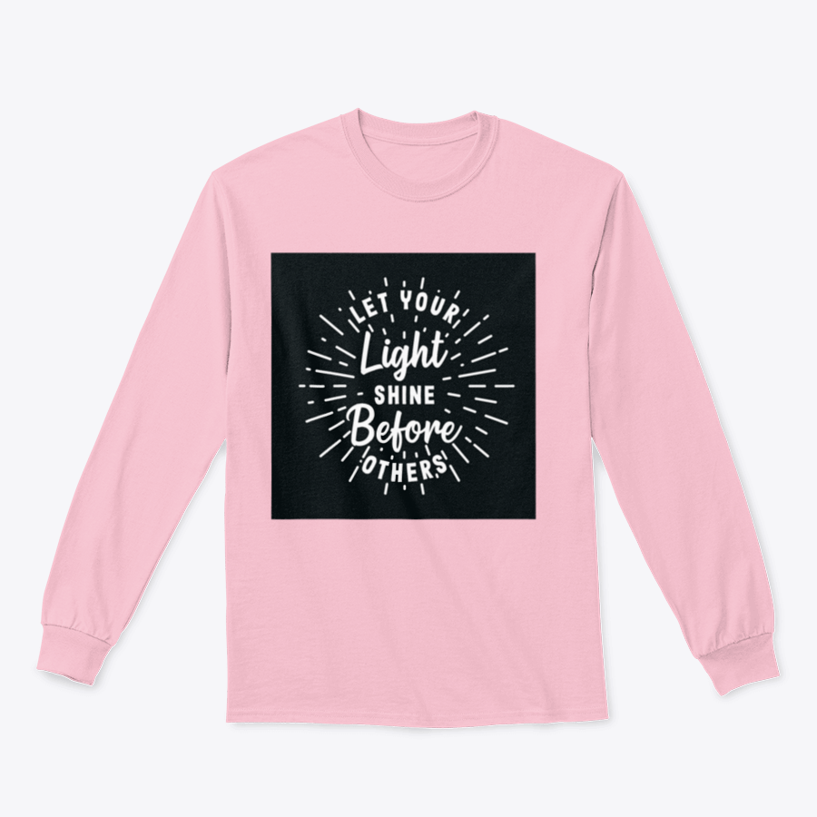 A stylish hand lettering typography shirt with the phrase 'Let Your Light Shine Before Others' displayed prominently, made from soft cotton fabric.