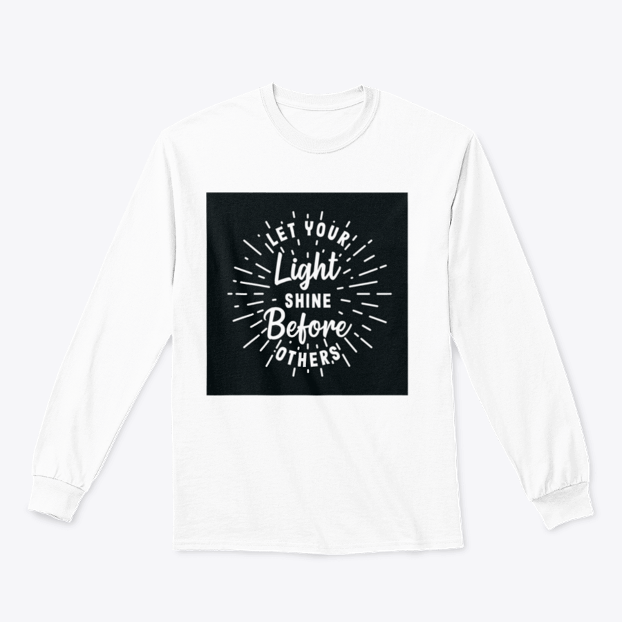 A stylish hand lettering typography shirt with the phrase 'Let Your Light Shine Before Others' displayed prominently, made from soft cotton fabric.