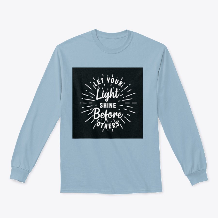 A stylish hand lettering typography shirt with the phrase 'Let Your Light Shine Before Others' displayed prominently, made from soft cotton fabric.