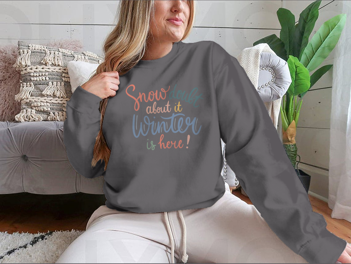 A cozy winter shirt featuring the quote 'Snow Doubt About It' in stylish lettering, perfect for winter enthusiasts.