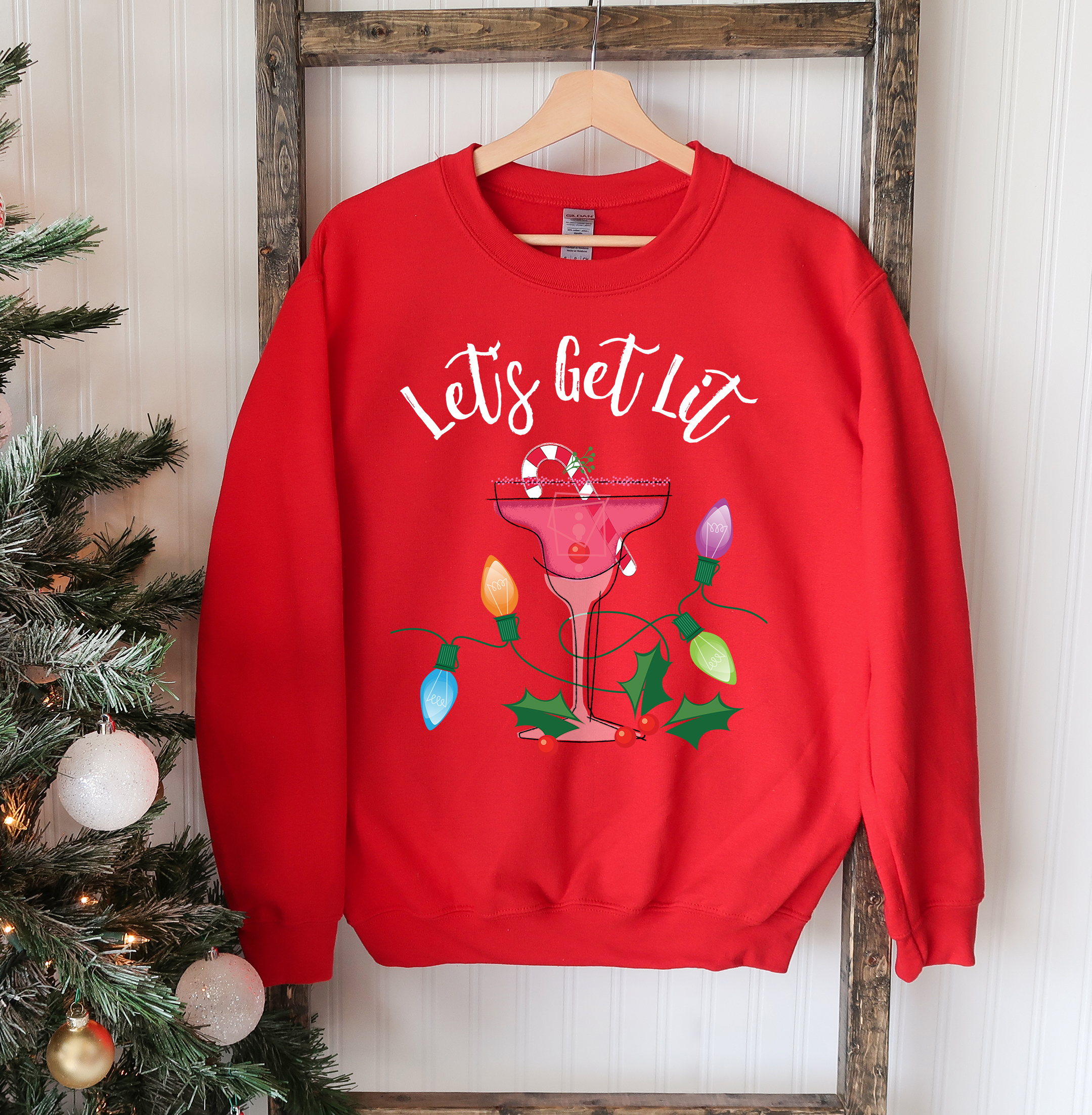 A cozy unisex sweatshirt featuring a festive 'Let's Get Lit' design, perfect for Christmas celebrations.