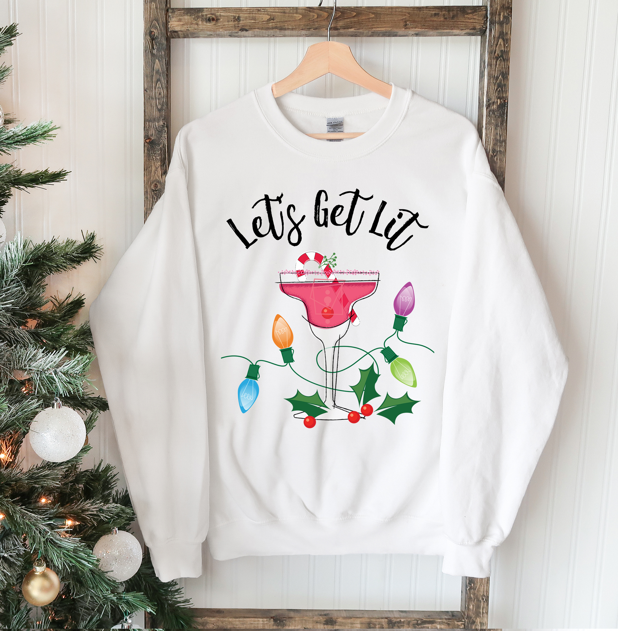 A cozy unisex sweatshirt featuring a festive 'Let's Get Lit' design, perfect for Christmas celebrations.