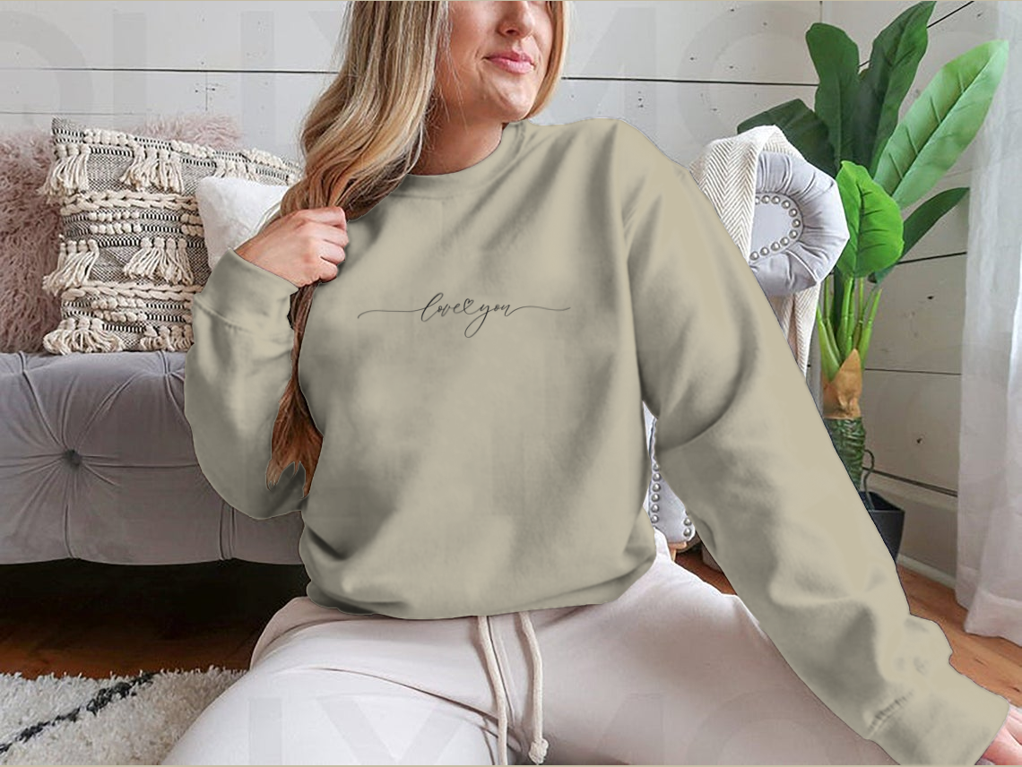 A cozy Love You Design sweatshirt made from 100% cotton, featuring a stylish graphic that expresses love.