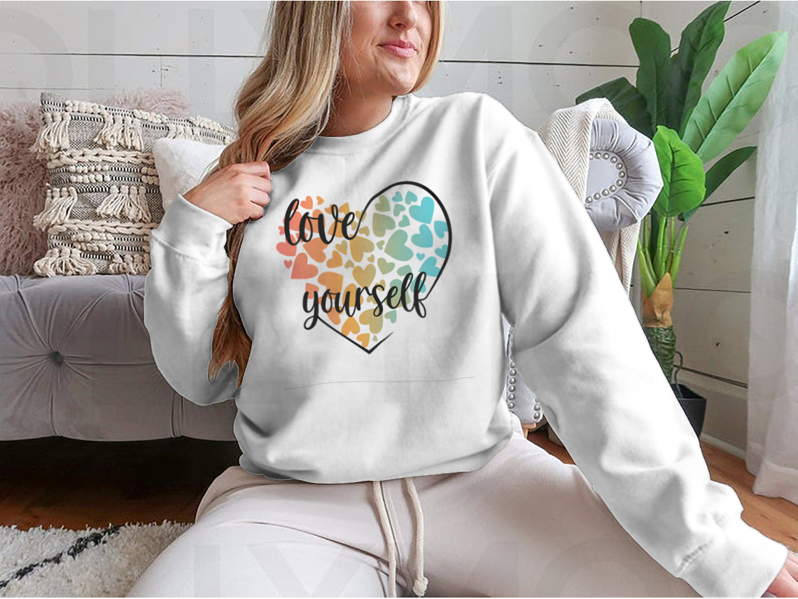 A cozy sweatshirt featuring a unique Love Yourself design with hearts and lettering, perfect for casual wear.