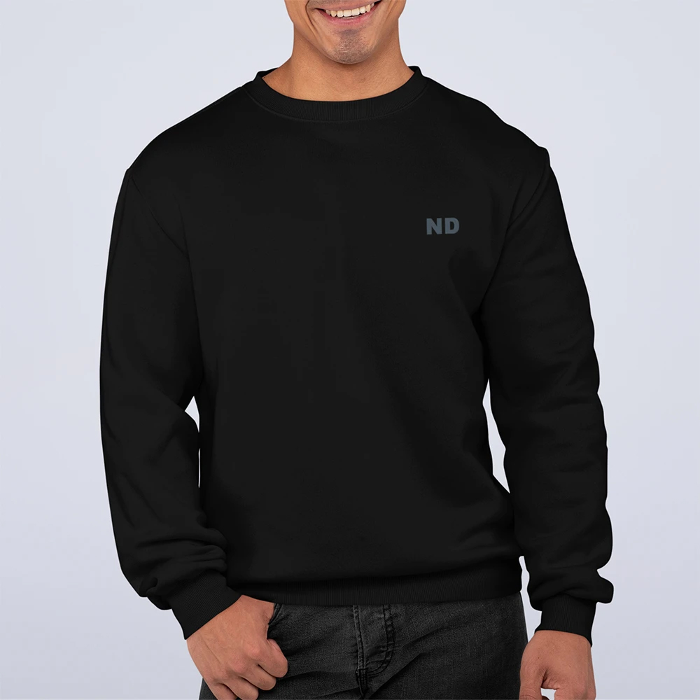 Mens ND Sweatshirt featuring a unique swirl back design, ribbed collar, and loose fit, made from a cotton-polyester blend.