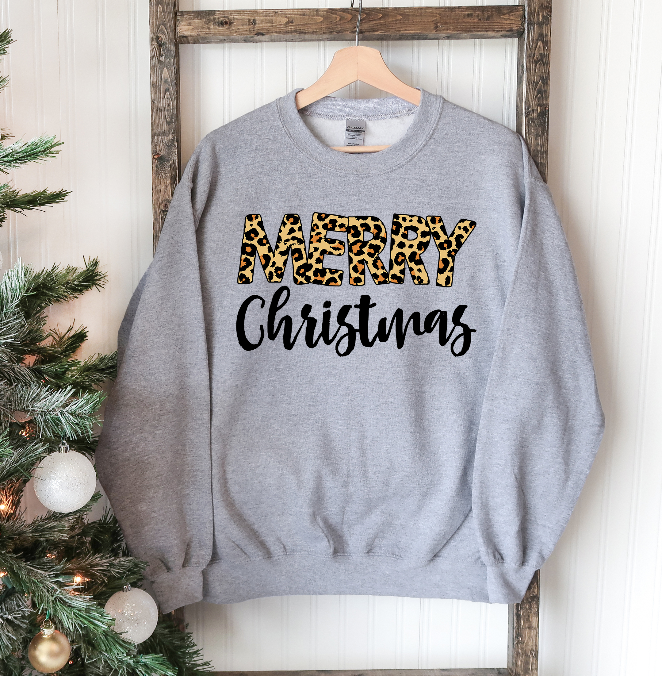 A cozy Merry Christmas Sweatshirt featuring a classic crew neck design, made from soft cotton-polyester blend fabric, perfect for festive occasions.