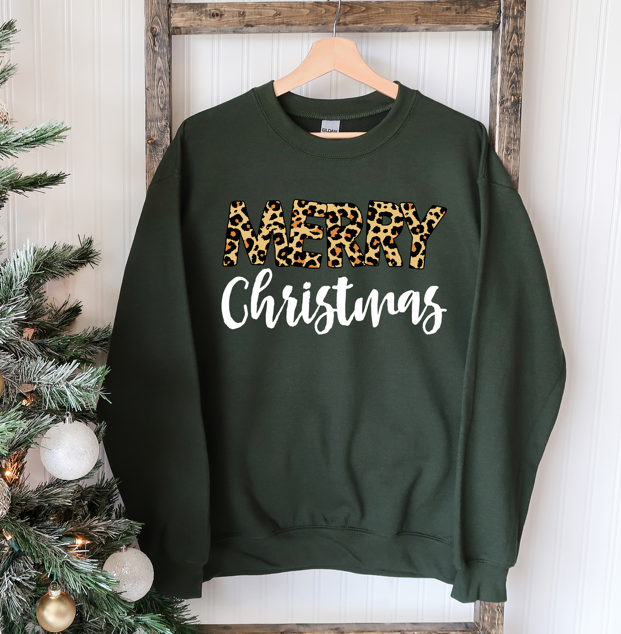 A cozy Merry Christmas Sweatshirt featuring a classic crew neck design, made from soft cotton-polyester blend fabric, perfect for festive occasions.