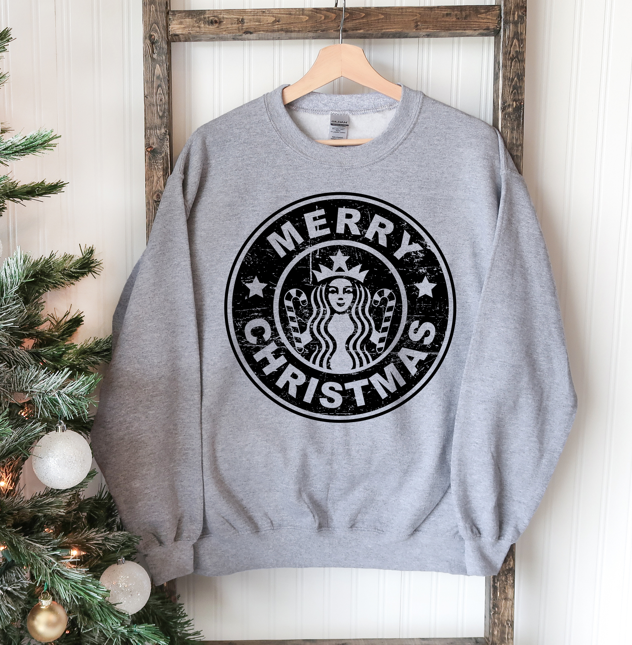 A cozy Merry Christmas Sweatshirt featuring a festive design, perfect for holiday celebrations.