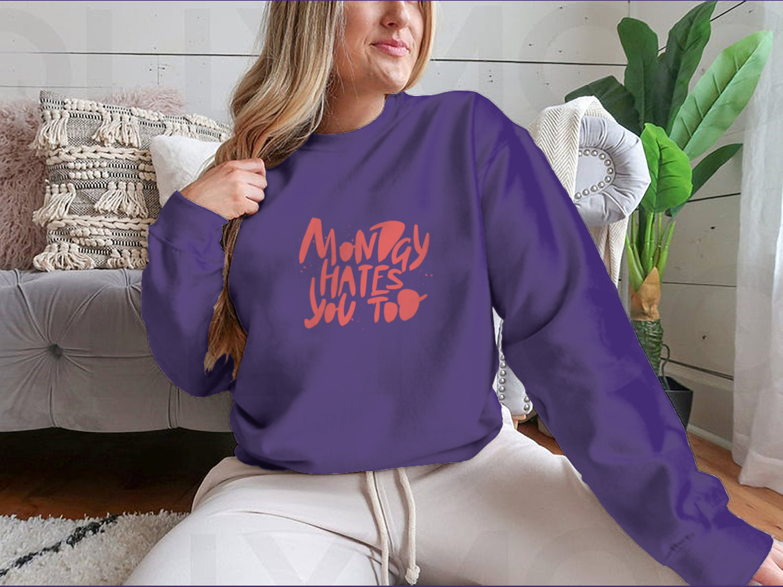 A stylish sweatshirt featuring the phrase 'Monday Hates You', made from a comfortable cotton-polyester blend.