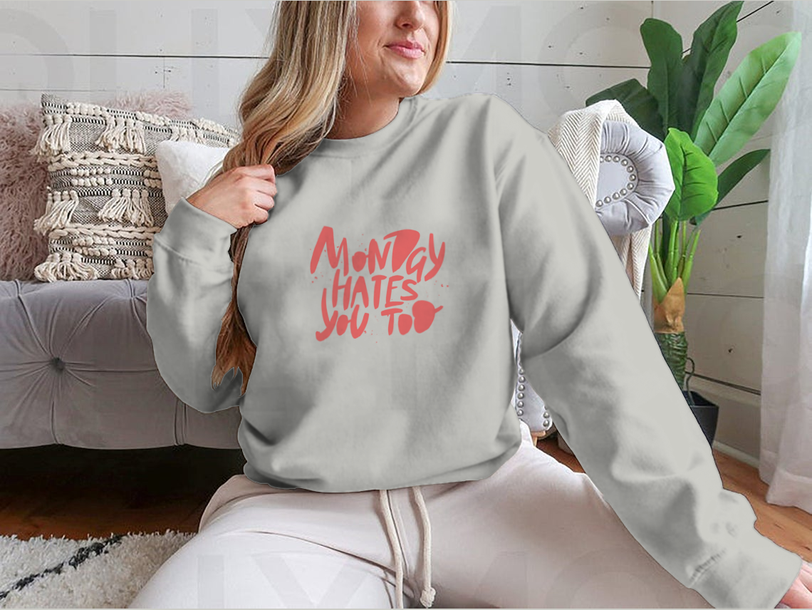 A stylish sweatshirt featuring the phrase 'Monday Hates You', made from a comfortable cotton-polyester blend.