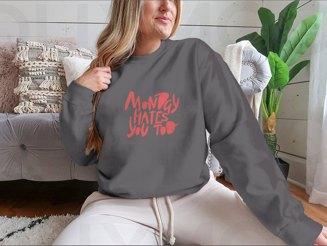 A stylish sweatshirt featuring the phrase 'Monday Hates You', made from a comfortable cotton-polyester blend.