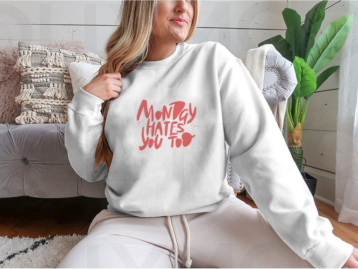 A stylish sweatshirt featuring the phrase 'Monday Hates You', made from a comfortable cotton-polyester blend.