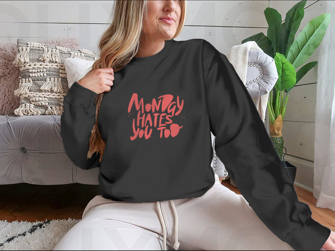 A stylish sweatshirt featuring the phrase 'Monday Hates You', made from a comfortable cotton-polyester blend.