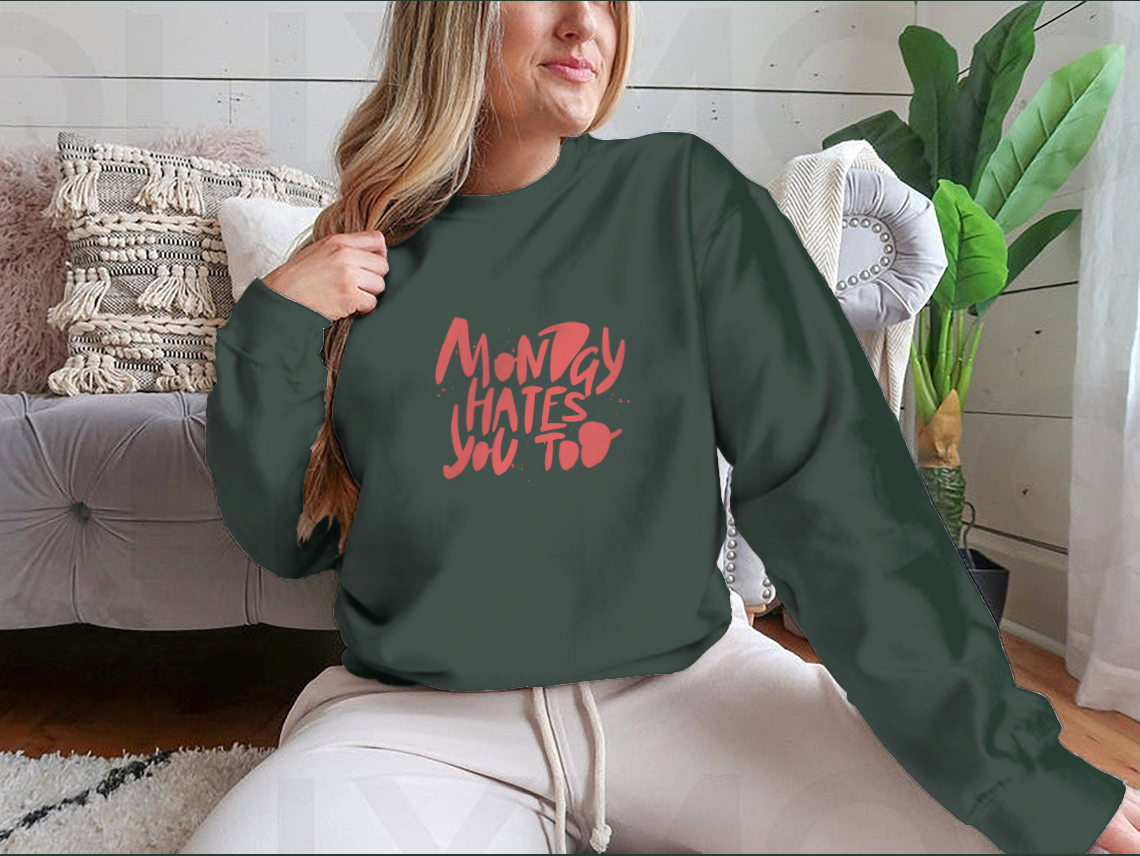 A stylish sweatshirt featuring the phrase 'Monday Hates You', made from a comfortable cotton-polyester blend.