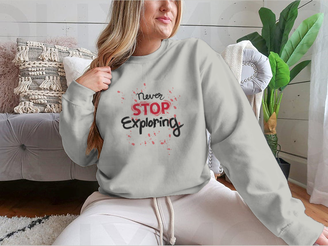 A stylish sweatshirt featuring the phrase 'Never Stop Exploring', made from a comfortable cotton-polyester blend, perfect for outdoor activities.