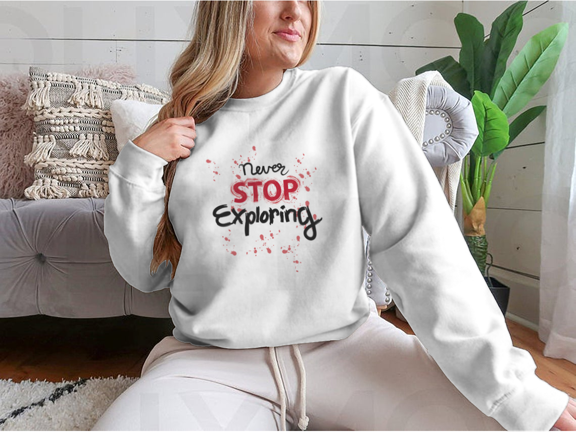 A stylish sweatshirt featuring the phrase 'Never Stop Exploring', made from a comfortable cotton-polyester blend, perfect for outdoor activities.