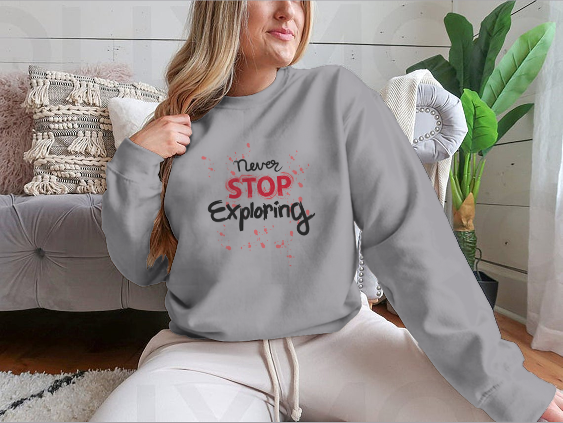 A stylish sweatshirt featuring the phrase 'Never Stop Exploring', made from a comfortable cotton-polyester blend, perfect for outdoor activities.