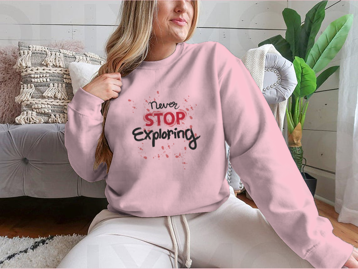 A stylish sweatshirt featuring the phrase 'Never Stop Exploring', made from a comfortable cotton-polyester blend, perfect for outdoor activities.