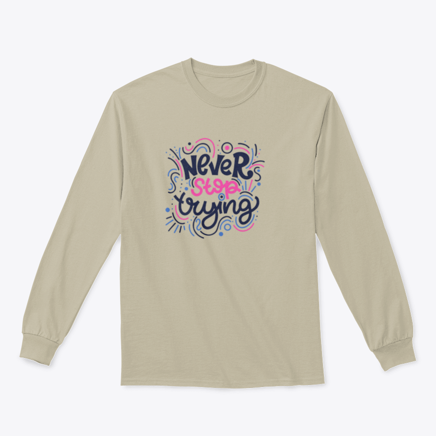 A vibrant t-shirt featuring the motivational phrase 'Never Stop Trying' in bright colored letters, showcasing a modern hand-drawn design.