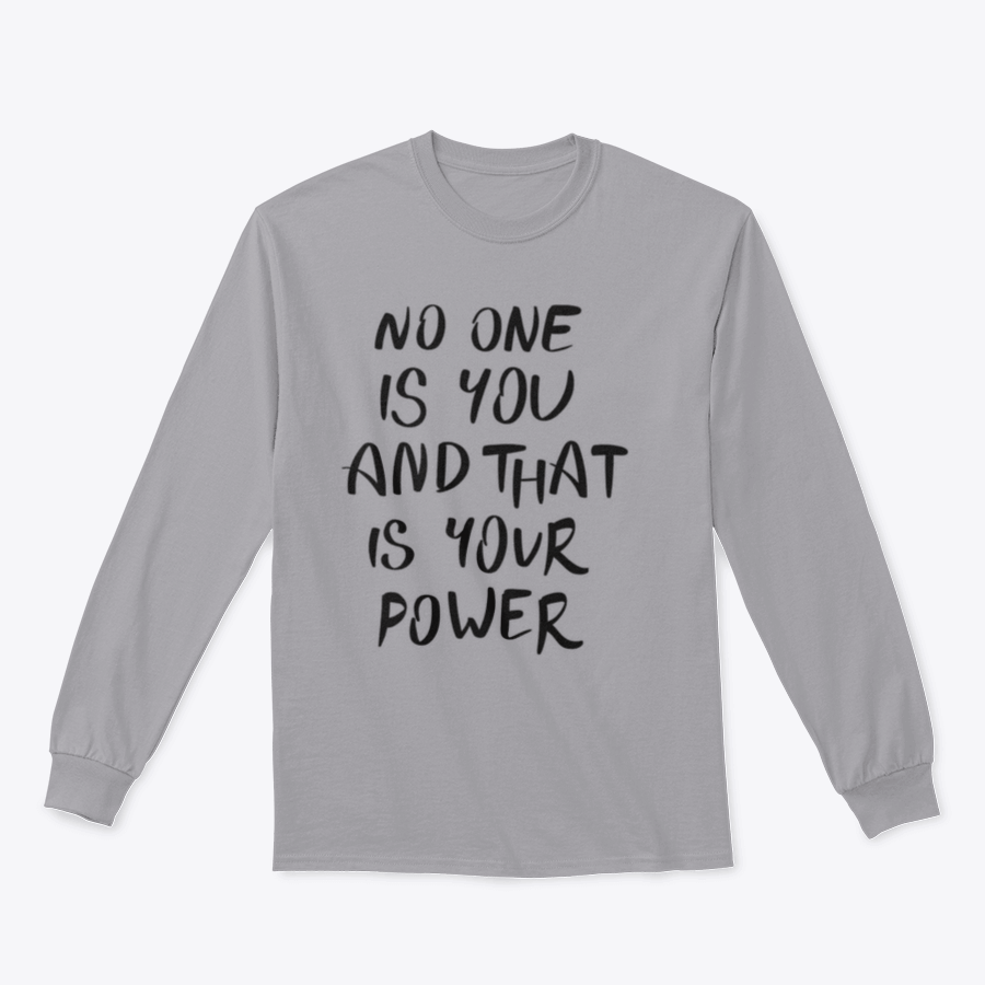 A stylish t-shirt featuring the hand-written calligraphy quote 'No One Is You And That Is Your Power' on a soft cotton fabric.