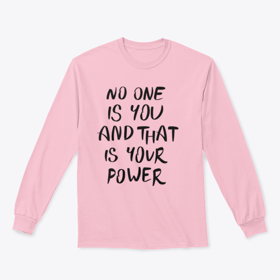 A stylish t-shirt featuring the hand-written calligraphy quote 'No One Is You And That Is Your Power' on a soft cotton fabric.