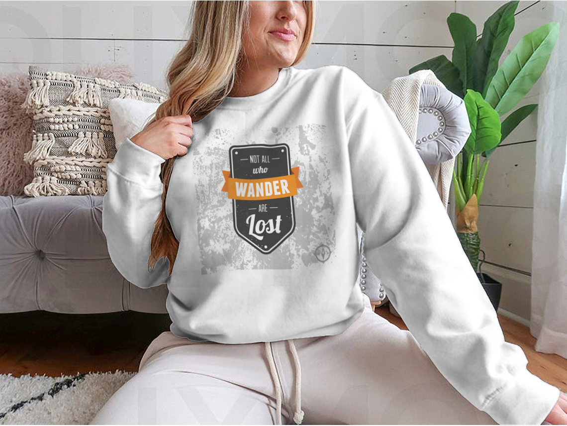 A cozy sweatshirt featuring the inspirational quote 'Not All Who Wander Are Lost' in stylish typography, perfect for adventurers.