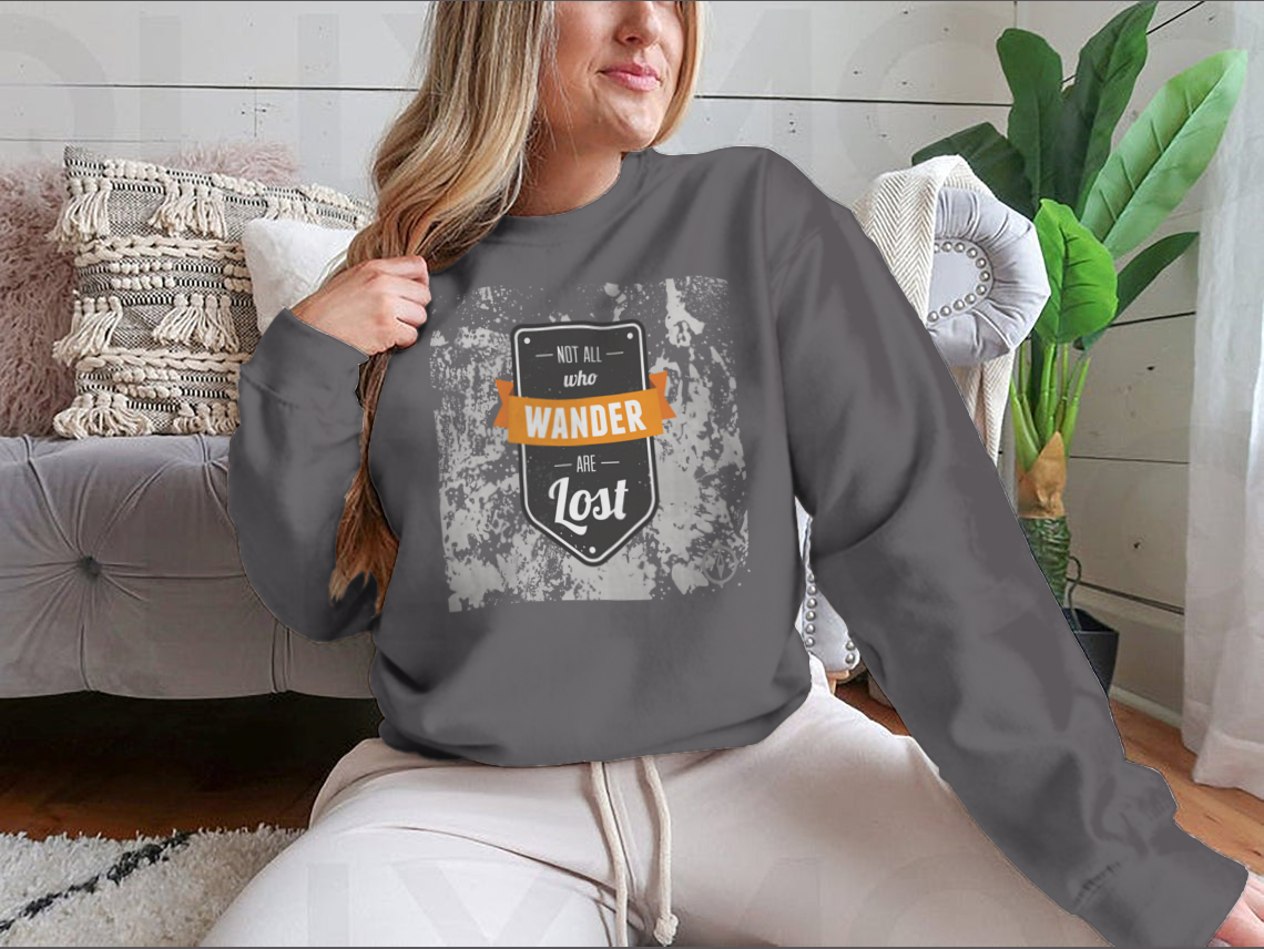 A cozy sweatshirt featuring the inspirational quote 'Not All Who Wander Are Lost' in stylish typography, perfect for adventurers.