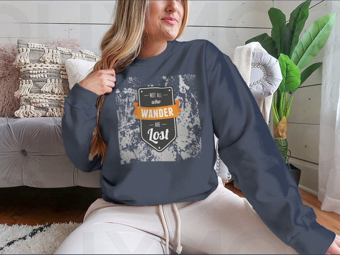 A cozy sweatshirt featuring the inspirational quote 'Not All Who Wander Are Lost' in stylish typography, perfect for adventurers.