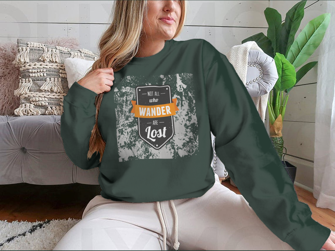 A cozy sweatshirt featuring the inspirational quote 'Not All Who Wander Are Lost' in stylish typography, perfect for adventurers.