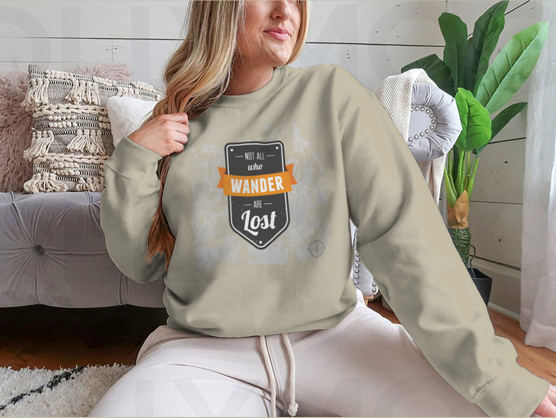 A cozy sweatshirt featuring the inspirational quote 'Not All Who Wander Are Lost' in stylish typography, perfect for adventurers.