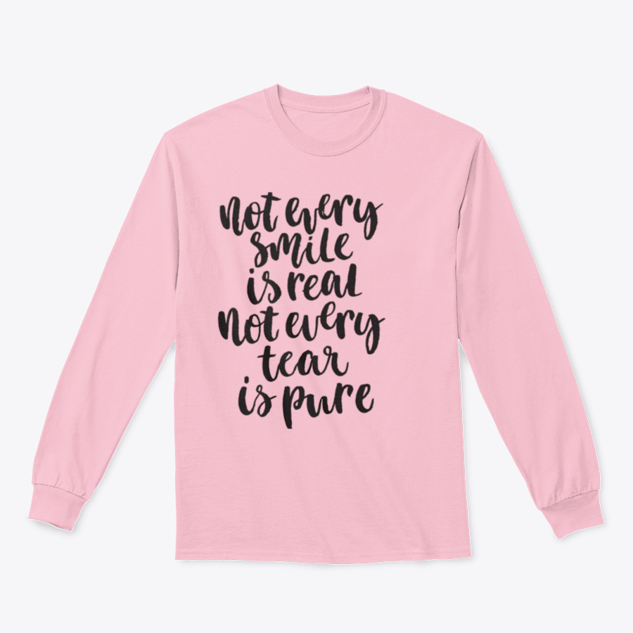 A stylish hand-lettered shirt featuring the phrase 'Not Every Smile Is Real Not Every Tear Is Pure' in an artistic design.