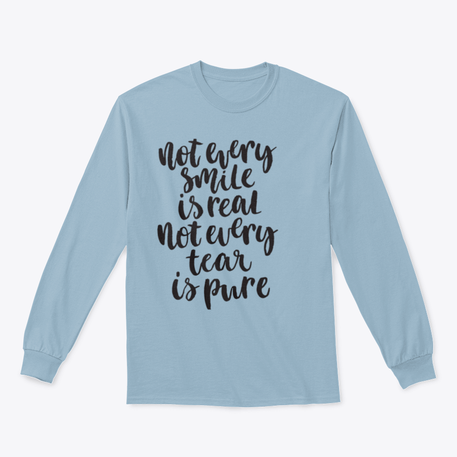 A stylish hand-lettered shirt featuring the phrase 'Not Every Smile Is Real Not Every Tear Is Pure' in an artistic design.